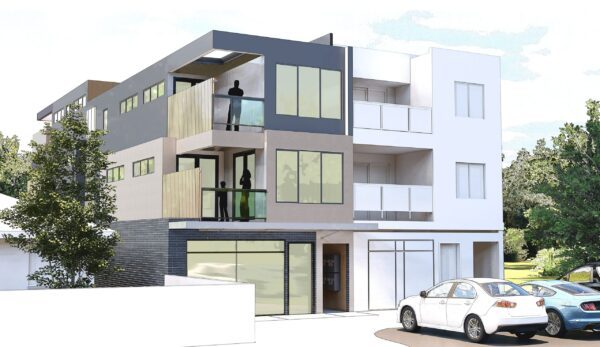 Modern apartment building with contemporary facade and green landscaping.